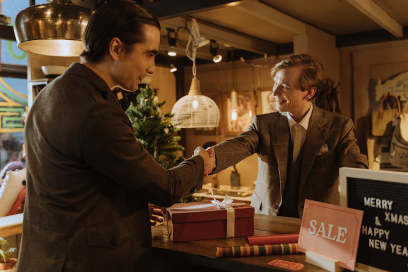 store owner and customer shaking their hands