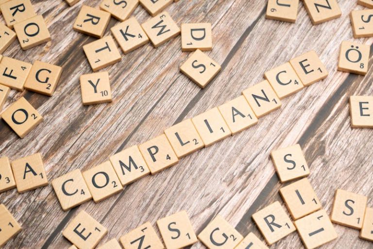compliance written on small wooden tiles